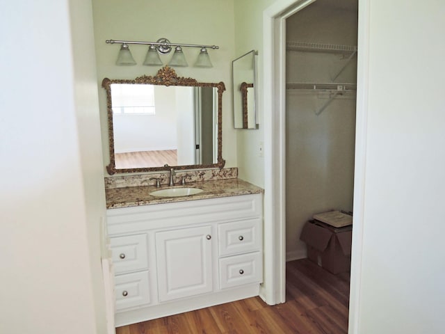 bathroom featuring hardwood / wood-style floors and vanity