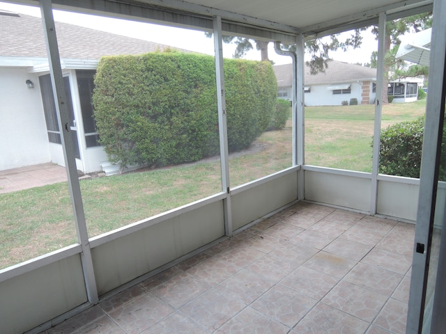 unfurnished sunroom featuring a healthy amount of sunlight