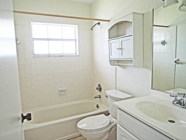 full bathroom with vanity, toilet, and tiled shower / bath combo