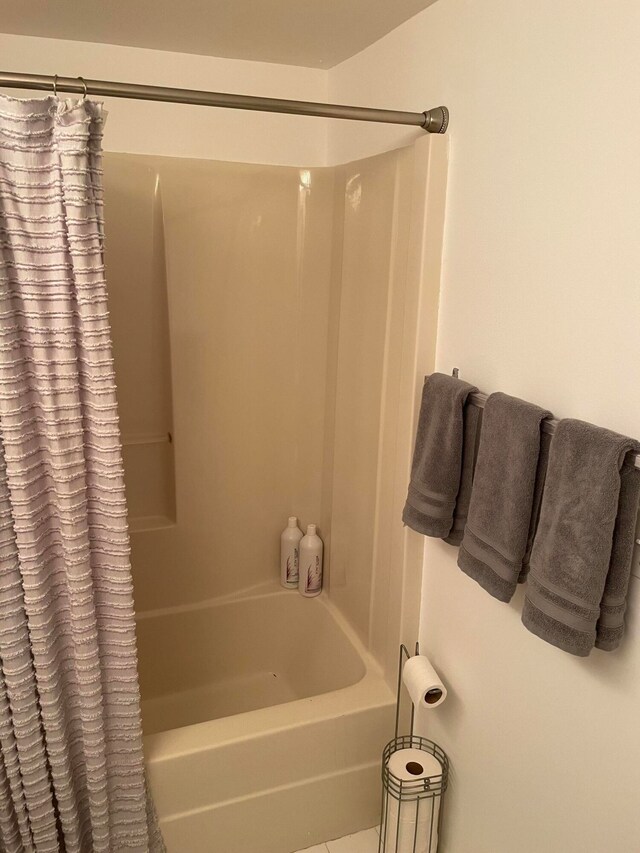 bathroom featuring shower / bath combination with curtain