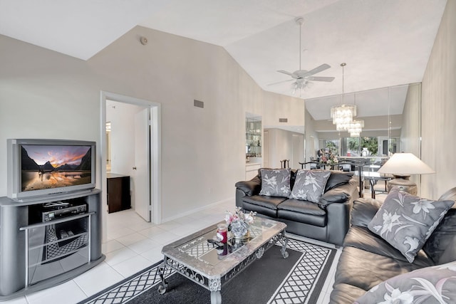 tiled living room with ceiling fan with notable chandelier and high vaulted ceiling