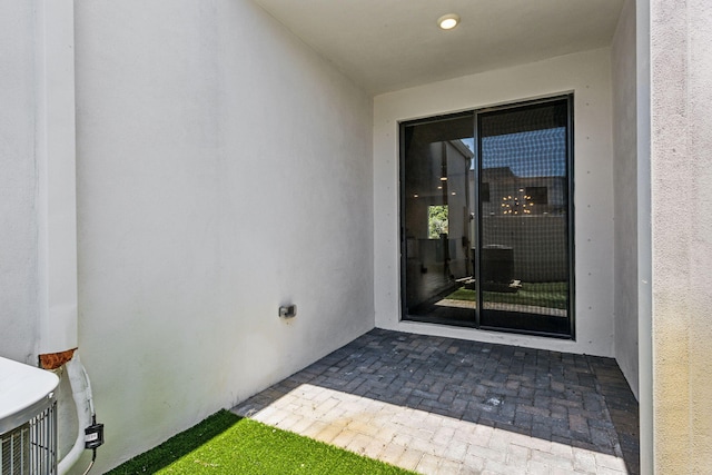 property entrance with a patio area