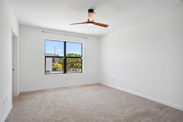 unfurnished room featuring carpet and ceiling fan