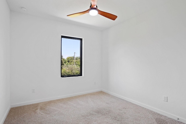 spare room featuring carpet floors and ceiling fan