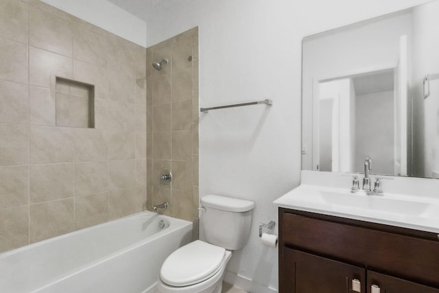 full bathroom featuring vanity, tiled shower / bath combo, and toilet