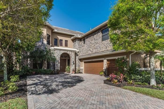 view of front of property with a garage