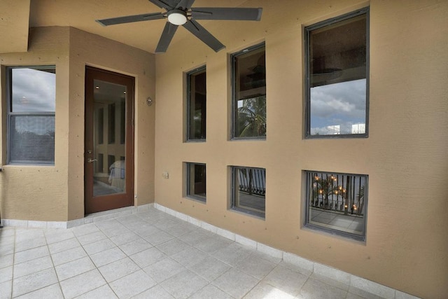 view of patio featuring ceiling fan