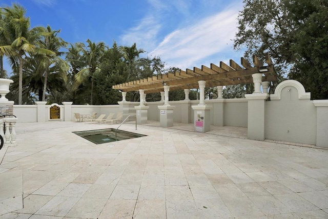 view of patio / terrace with a pergola and a community hot tub