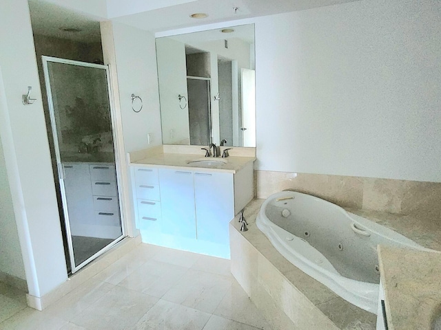 bathroom featuring vanity with extensive cabinet space, tile floors, and separate shower and tub