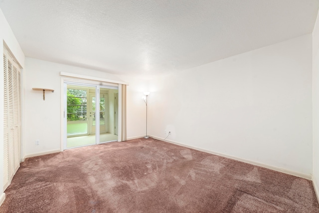 spare room featuring carpet flooring