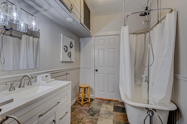 bathroom featuring vanity and shower / bath combo