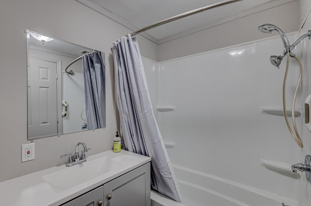 bathroom featuring crown molding, vanity, and shower / tub combo