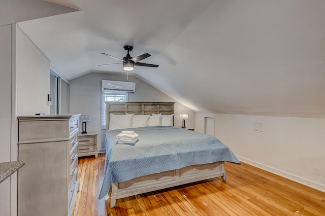 bedroom with a wall mounted AC, light wood-type flooring, ceiling fan, and lofted ceiling