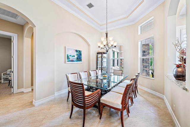 dining area featuring an inviting chandelier and ornamental molding