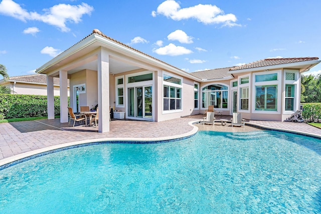 view of pool featuring a patio area