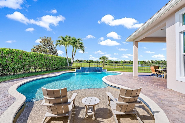 view of pool featuring pool water feature and a patio area