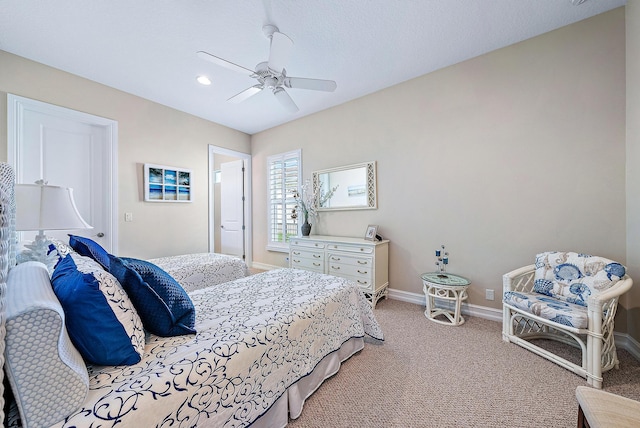 bedroom featuring ceiling fan and light carpet