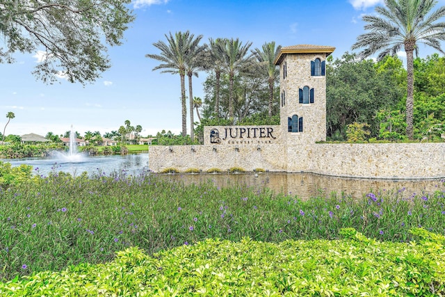 community sign with a water view