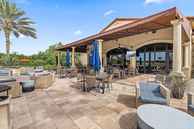 view of patio featuring outdoor lounge area and ceiling fan