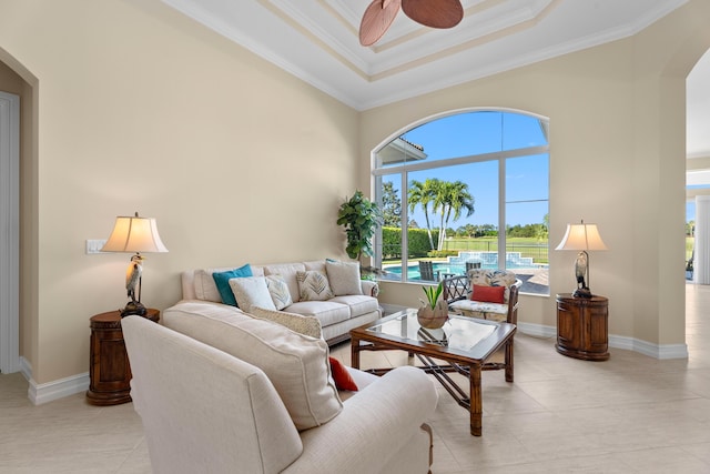 living room with crown molding, ceiling fan, and light tile patterned flooring