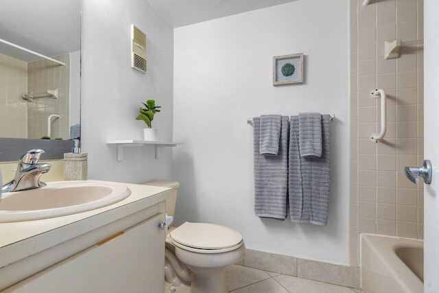 bathroom featuring toilet, vanity, and tile patterned floors