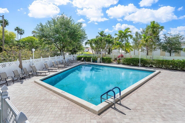 view of swimming pool with a patio area