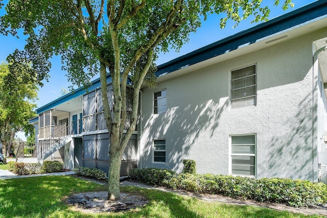 view of home's exterior with a lawn