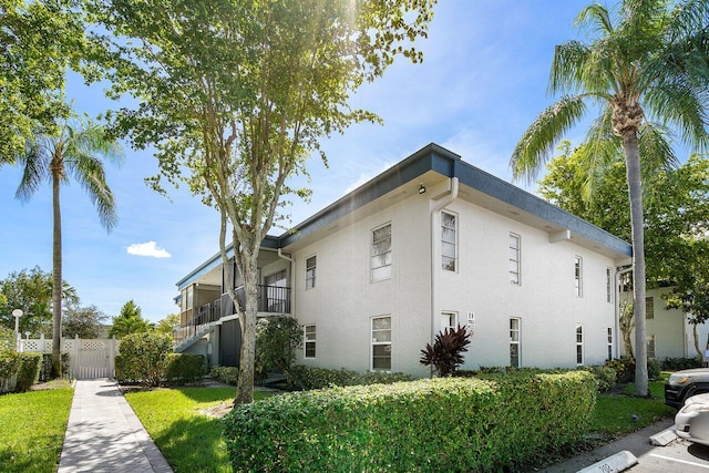 view of property exterior with a balcony