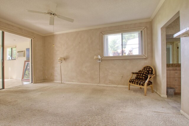 unfurnished room with light carpet, ceiling fan, ornamental molding, and a textured ceiling