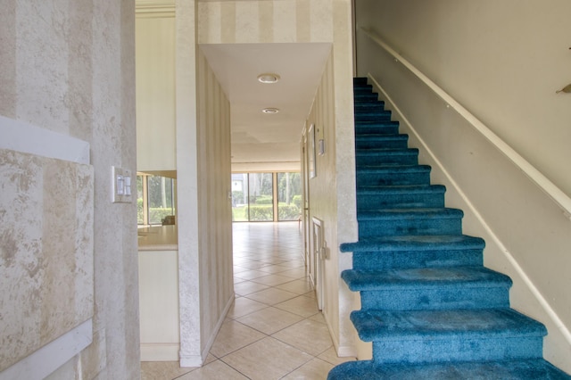 staircase featuring tile patterned floors