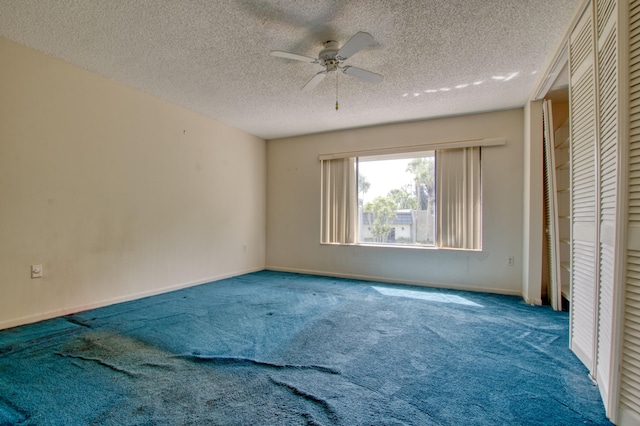 unfurnished bedroom featuring a textured ceiling, ceiling fan, and carpet flooring