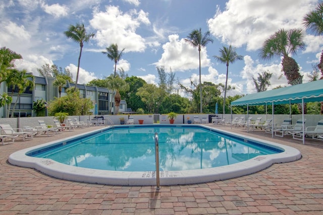 view of swimming pool with a patio area