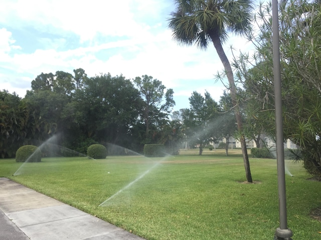 surrounding community featuring a lawn