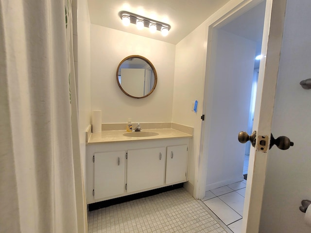 bathroom featuring tile floors and vanity