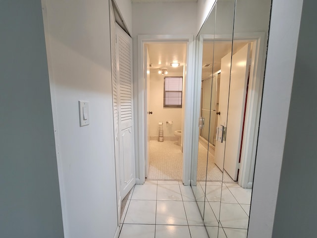 hallway featuring light tile floors