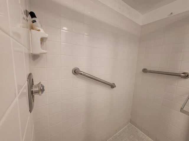 bathroom with tiled shower