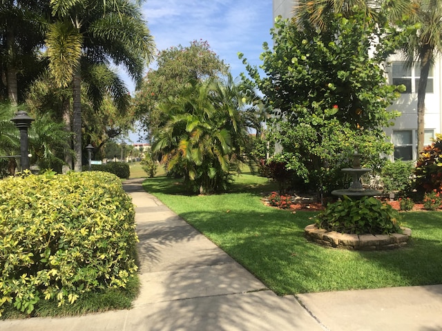 view of home's community with a lawn