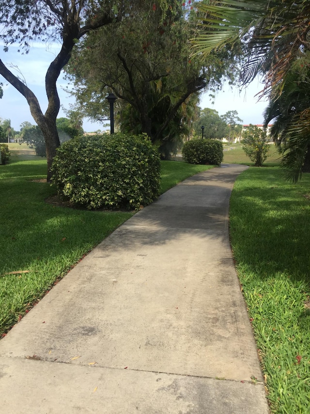 surrounding community featuring a lawn