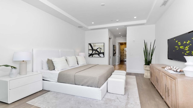 bedroom with light hardwood / wood-style flooring