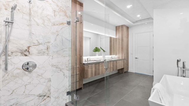 bathroom featuring tile flooring, double vanity, and independent shower and bath