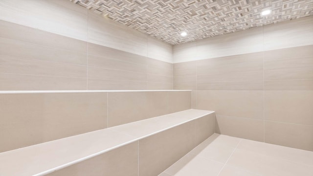 bathroom with tile walls