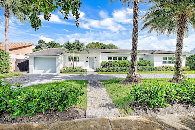 ranch-style home with a garage