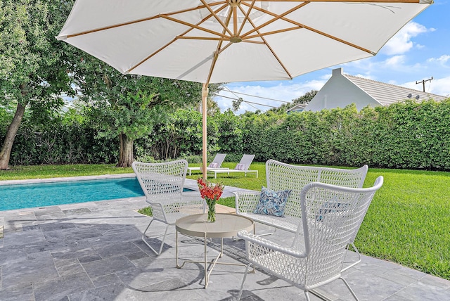 view of patio with a fenced in pool