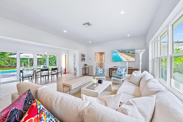 living room with a healthy amount of sunlight and wood-type flooring