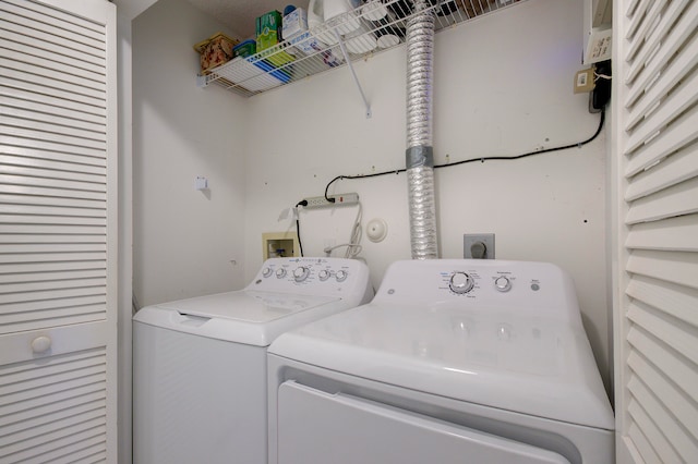 washroom with washer and clothes dryer