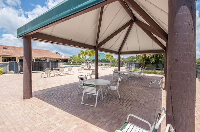 view of patio with a gazebo and a community pool