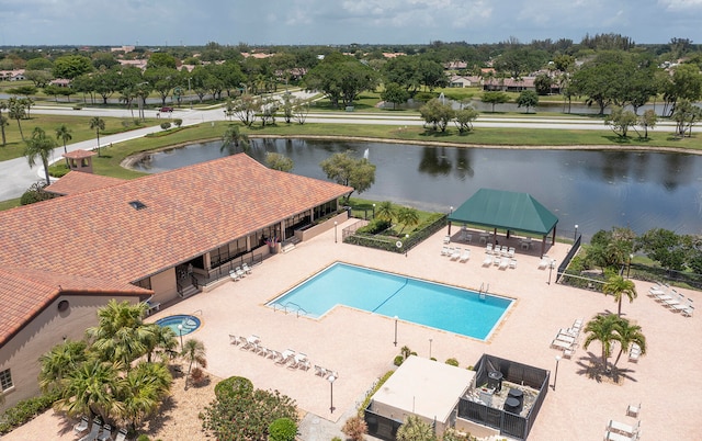 view of swimming pool featuring a patio, a gazebo, and a water view