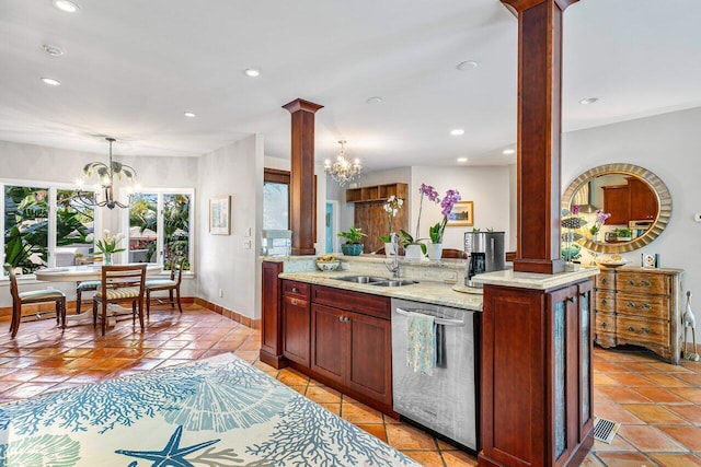 kitchen with sink, ornate columns, dishwasher, and light tile floors