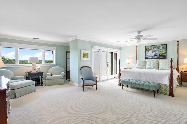 bedroom with ceiling fan, access to outside, carpet floors, ornamental molding, and a wood stove