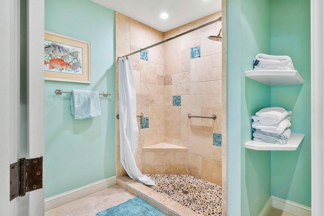 bathroom with a shower with shower curtain and tile flooring